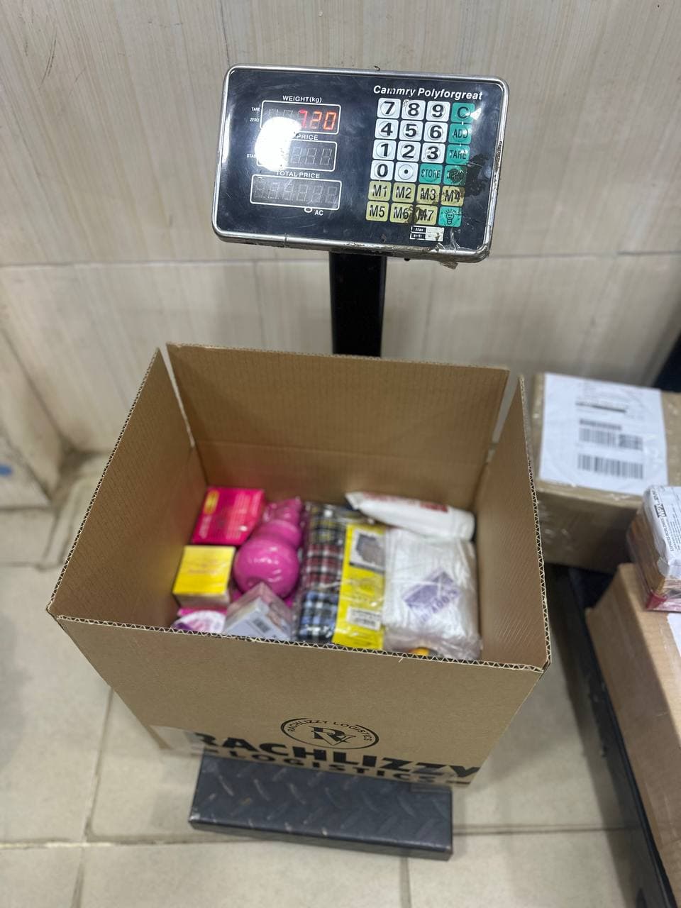 Shipment carton weighed and packed for dispatch