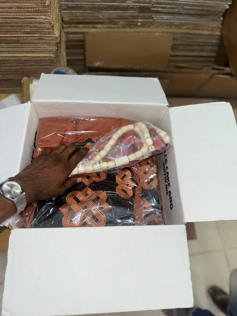 Items being packed into a shipping box
