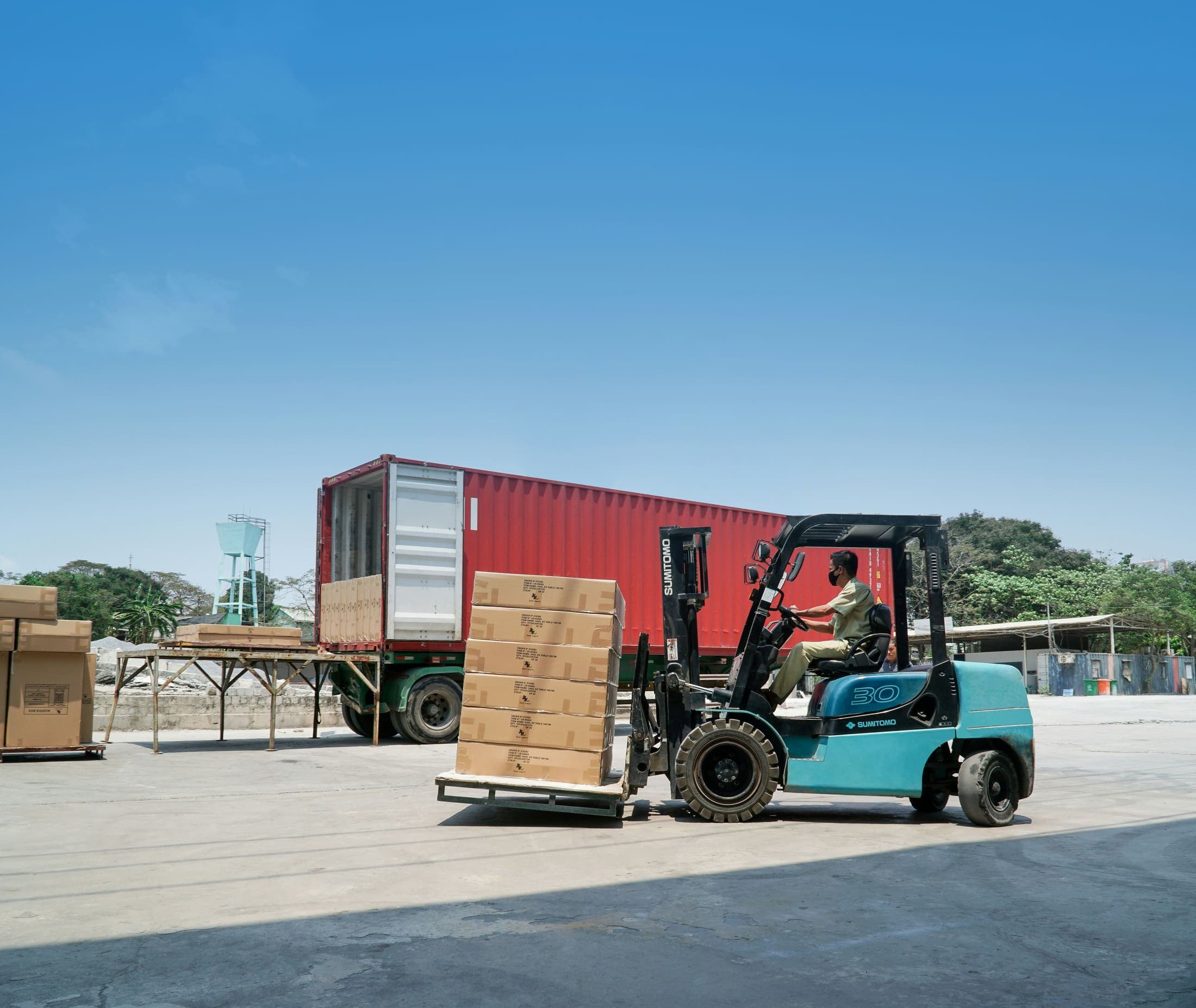 Forklift moving pallets in a warehouse